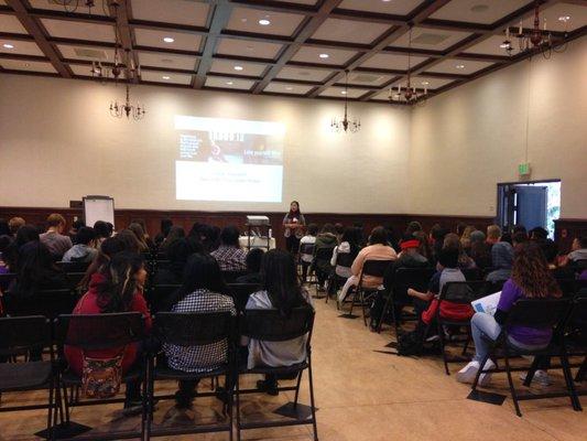 Junia sharing Holistic Wellness Education to Middle Schoolers: "Love Yourself, Don't Be Your Own Hater"