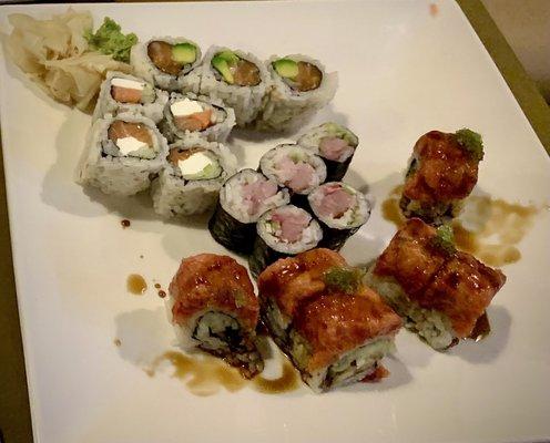 Philadelphia roll, salmon avocado, green dragon roll, yellowtail sushi - dining in the restaurant