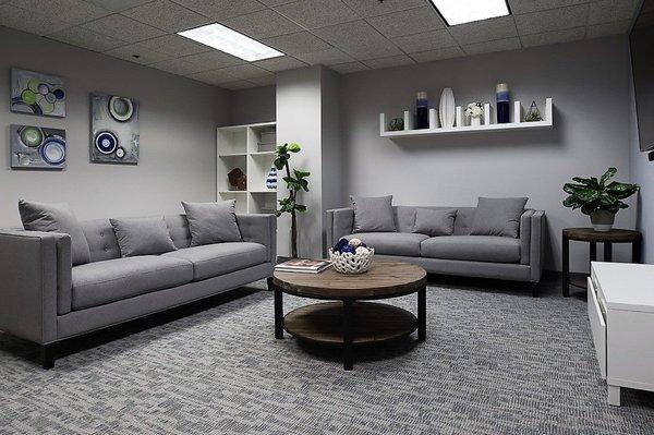 The Berman Center's community room- includes a massage chair, a flat screen TV and an X-box.