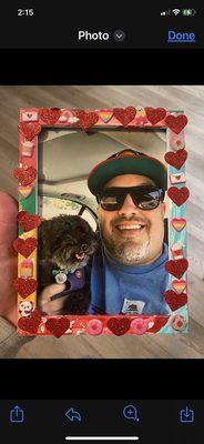 Late husband with our dog. Our little niece picked her favorite pic of her uncle and decorated the frame. Love it!