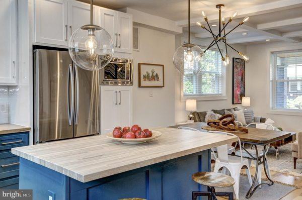 Blue Wave shaker cabinets with white shaker uppers make for an enjoyable kitchen