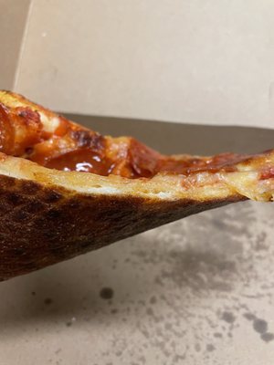 Dry out crust, probably sat there under heat lamps for a while.