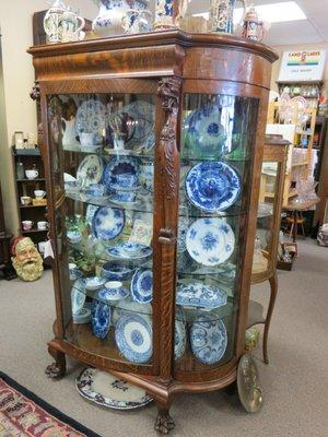 Numerous display cabinets full of hand painted and flow blue porcelains.