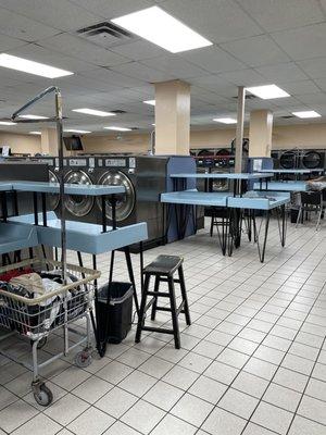 Many clean, double-decker folding tables at both ends of all the aisles.