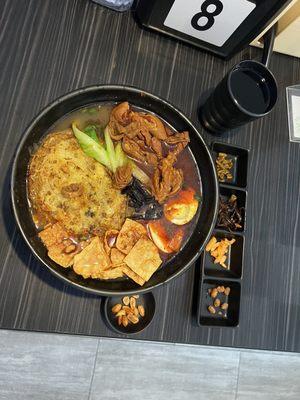 Snail rice noodle with extra fried egg and intestine.