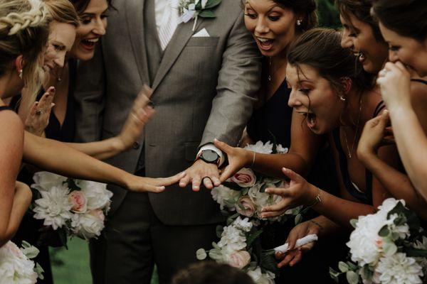 Bridesmaids gawk over grooms ring!