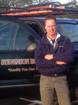 Jon Stevenson beside Stevenson Roofing Truck