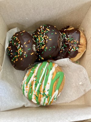 Vanilla raised, double chocolate, and Boston cream pie doughnuts