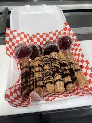 Stuffed churros with strawberry and chocolate, dipping sauce