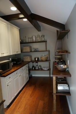 This is a custom pantry we designed, with the reclaimed parts of their old kitchen. The cabinets came out of the old kitchen ...