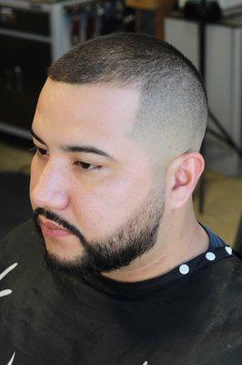 High skin fade with a tapered beard trim