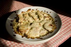 Baked Nebraska!  Spaghetti with loads of meat, and cheese.  Red sauce on one half, white sauce on the other.