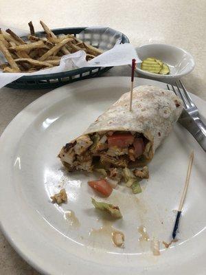 Half a grilled chicken wrap and fries