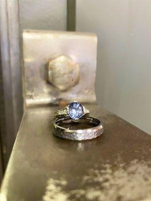 Vintage Inspired custom made engagement ring with blue spinel gemstone with Lashbrook wedding band for the groom.