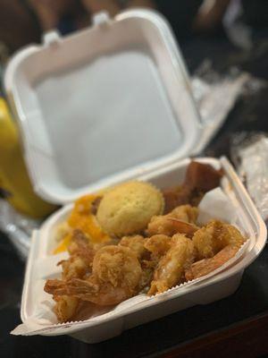 Fried shrimp, seafood rice, Mac n cheese and yams.