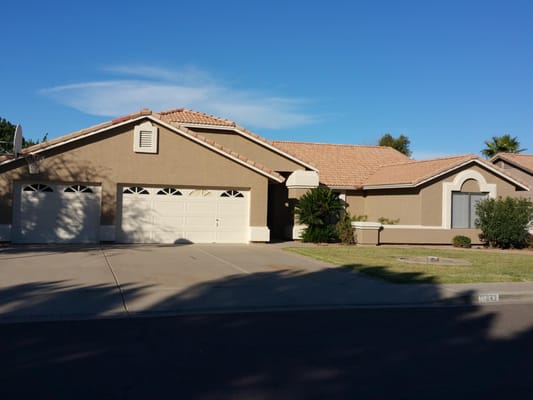 After we Power washed, filled all cracks and masked all unpainted areas we started to paint this home.