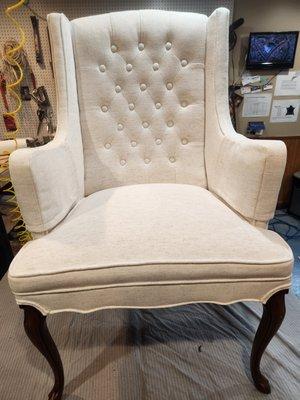 Vintage winged chair, white on white details.