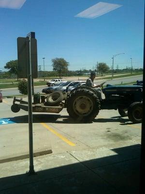 A long time client drove his tractor up to the office to talk with his agent. This is definitely "where the West begins."