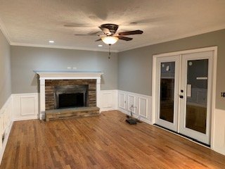 Family Room remodel, including custom fire place fascia and surround, new French doors and total paint job.