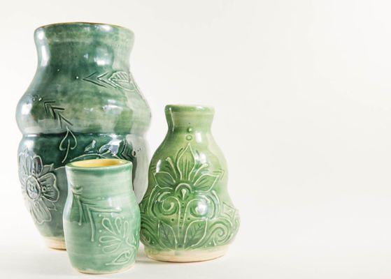 Assorted green vases