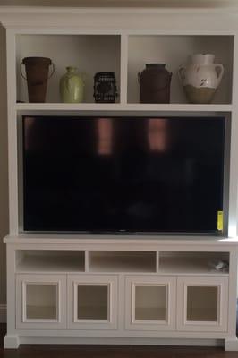 Custom cabinetry with 70 inch LED TV in remodeled living room installed in Lafayette, CA.