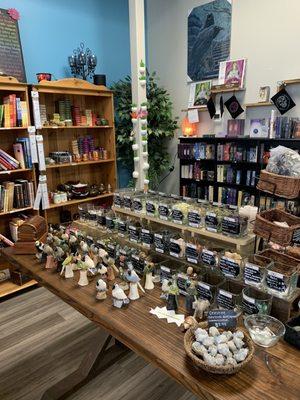 Individual rough and tumbled stones, tarot cards, books