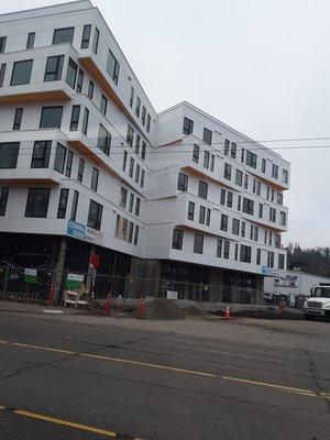 you can see the siding is unevenly put on and wrinkly, especially the 3rd and 4th floors in my opinion