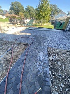 Paver walkway that leads to driveway