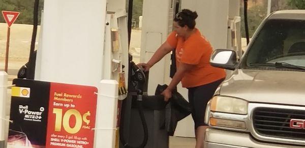 Come on you can't be smoking while you're changing out the trash at the pumps