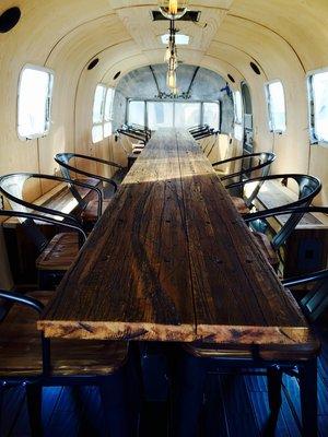 Interior conference room setup inside a vintage Airstream.