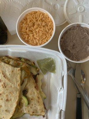 Zucchini quesadillas with side of rice and retried beans.