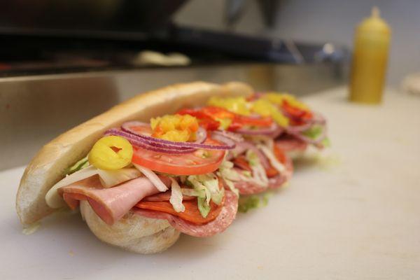 Our Italian sub with ham, capicola, salami, pepperoni and provolone cheese. With lettuce, tomato, onion, peppers and italian dressing!