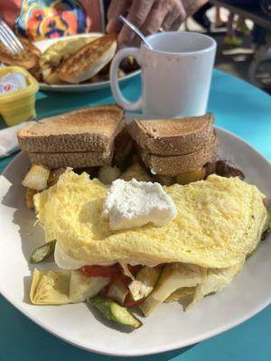 Spring omelette , fresh mozzarella , asparagus , artichokes and tomatoes with home potatoes and wheat toast!!!