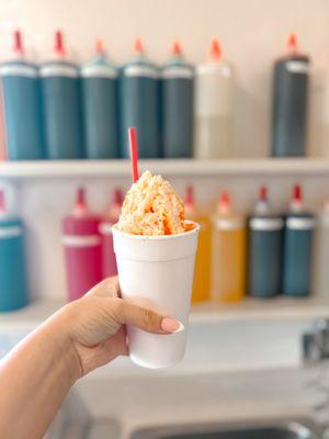 Orange snowcone - make it a Joe (ice cream center with cream on top)!