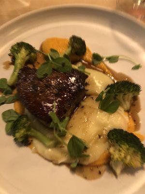 Beef tenderloin, puréed potatoes and broccoli.