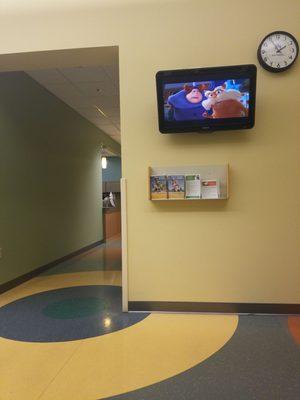 TV with kids movies in part of waiting area