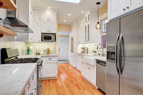 Remodel of a long, skinny kitchen creating lots of storage