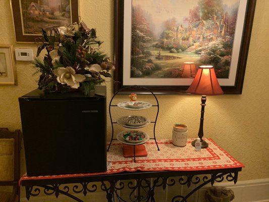 The table in the hallway that has the mini fridge and chocolates (open to anyone who wants it)