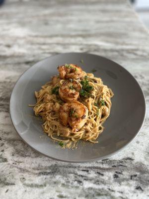 Crawfish pasta with blackened grilled shrimp