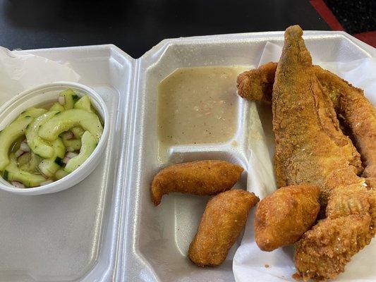 Fried whiting, navy beans, cucumber salad, hush puppies