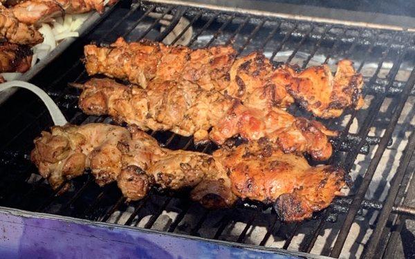 Vendor selling chicken kabobs