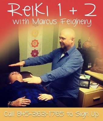 Reiki Master Marcus Feighery, Owner of Synchronicity, teaching Reiki.