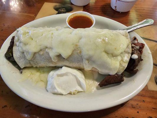 Tampiquena burrito with sauce on side.