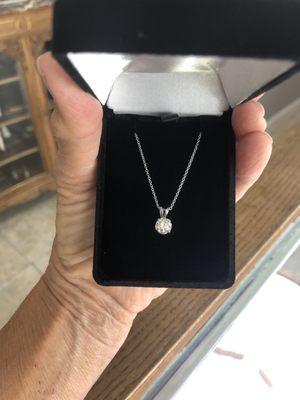 Diamond solitaire pendant, 14k white gold.