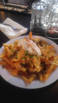 Ohhhh mm ggg sum of the best cheese fries Ive had in a while.NO pork.. Just beef. cheese sour cream  and seasoned fries.