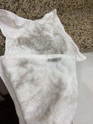 Dirty towels from cleaning kids' feet after walking barefoot in room. This was in the room with "recently shampooed" carpets.