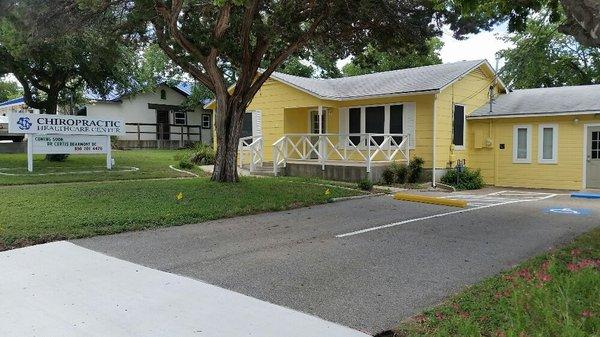 Our office is the yellow house on the corner of Avenue G and Broadway.