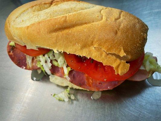 Italian Sub - ham, salami, capricola, provolone, shredded lettuce, tomatoes, red onion, italian seasoning, pepperoncini vinaigrette