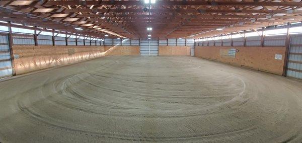 Spacious indoor riding arena with LED lighting. This arena is large enough for multiple horses to be ridden at the same time.