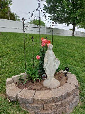 Mary and climbing rose